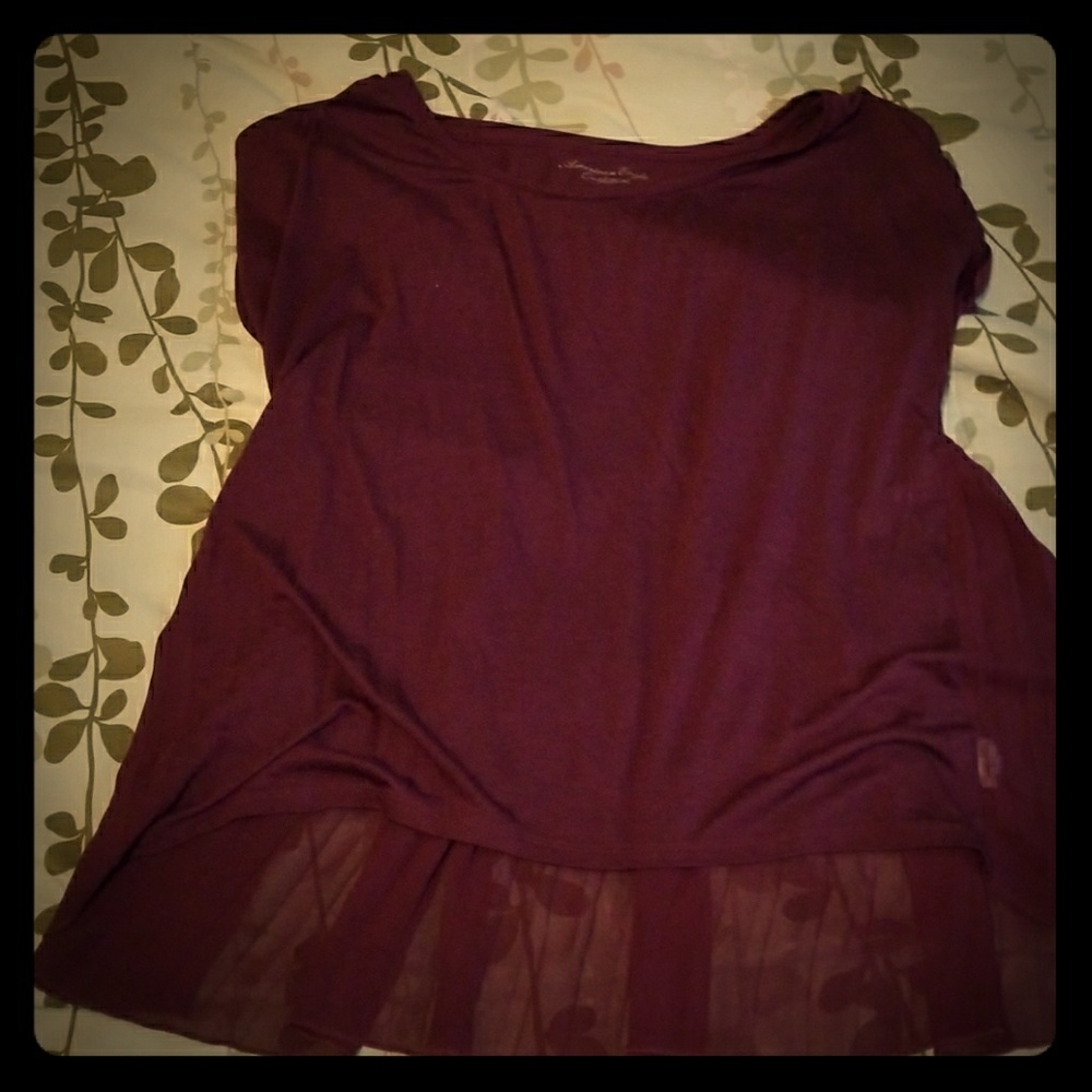 Cute,  peplum maroon color shirt..